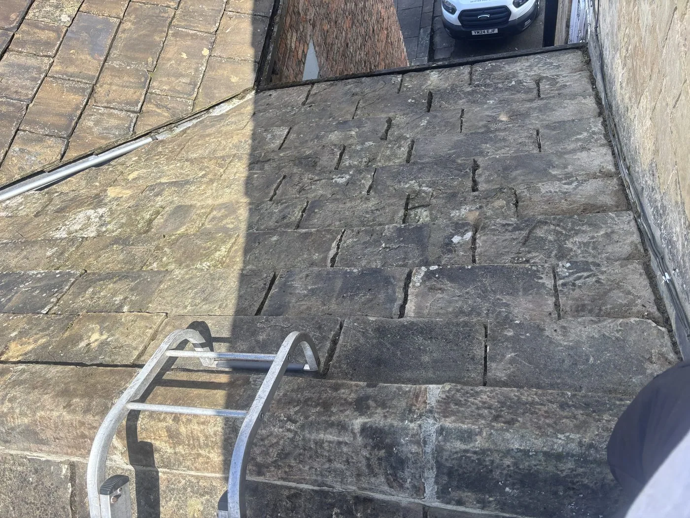 Vertical stone slate face after cleaning — 118 High Street Knaresborough, patina intact