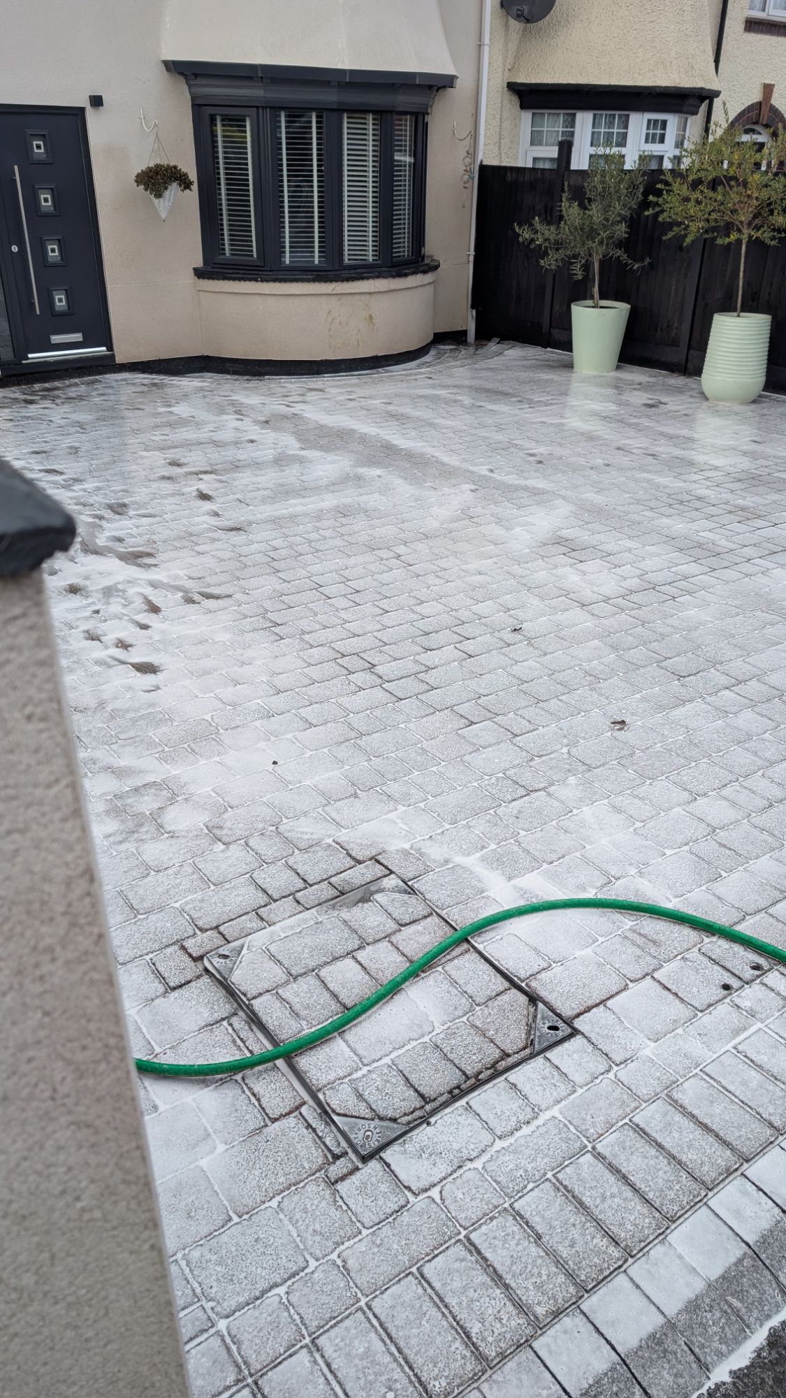 Sodium hypochlorite soft wash treatment applied to block paving driveway — chemical treatment Yorkshire