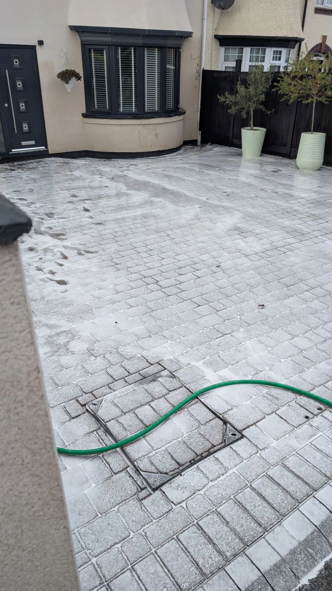 Sodium hypochlorite soft wash treatment applied to block paving driveway — chemical treatment Yorkshire